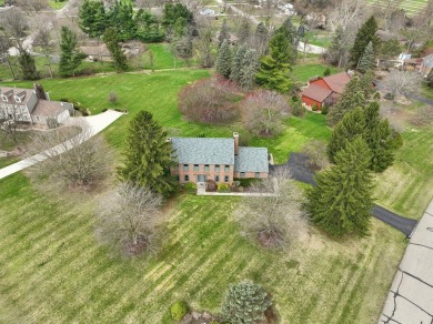 Timeless Richard Adams Russell design in prestigious Travis on Travis Pointe Country Club in Michigan - for sale on GolfHomes.com, golf home, golf lot
