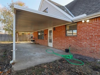 Move in ready! This home sits on a nearly  1/4  acre lot  is on Adams Municipal Golf Course in Oklahoma - for sale on GolfHomes.com, golf home, golf lot