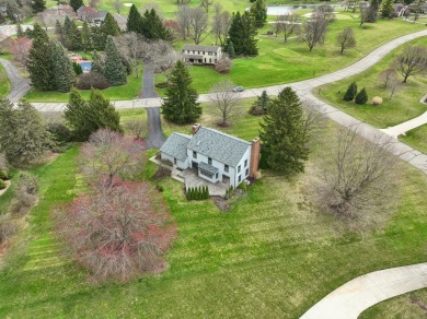 Timeless Richard Adams Russell design in prestigious Travis on Travis Pointe Country Club in Michigan - for sale on GolfHomes.com, golf home, golf lot