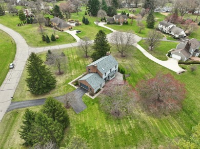Timeless Richard Adams Russell design in prestigious Travis on Travis Pointe Country Club in Michigan - for sale on GolfHomes.com, golf home, golf lot
