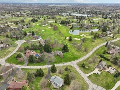 Timeless Richard Adams Russell design in prestigious Travis on Travis Pointe Country Club in Michigan - for sale on GolfHomes.com, golf home, golf lot