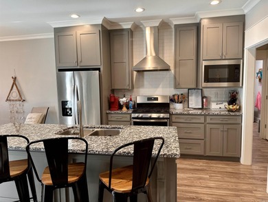 This house located in the Mystic Creek Golf Club area packs a on Mystic Creek Golf Club in Arkansas - for sale on GolfHomes.com, golf home, golf lot