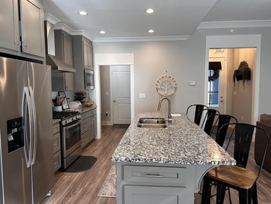 This house located in the Mystic Creek Golf Club area packs a on Mystic Creek Golf Club in Arkansas - for sale on GolfHomes.com, golf home, golf lot