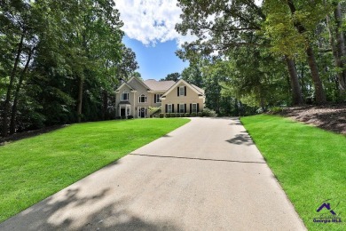 Discover sweeping views of Royal Lakes Golf & County Club's 1st on Royal Lakes Golf and Country Club in Georgia - for sale on GolfHomes.com, golf home, golf lot