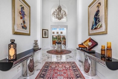 Soaring two-story ceiling heights greet you upon entering this on Polo Club of Boca Raton in Florida - for sale on GolfHomes.com, golf home, golf lot