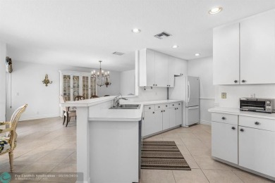 With serene views of the water and golf course, a 2021 roof, and on The Boca Country Club in Florida - for sale on GolfHomes.com, golf home, golf lot