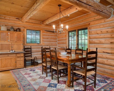 This charming log home, nestled in the trees and perched above on Big Sky of Montana Golf Course in Montana - for sale on GolfHomes.com, golf home, golf lot