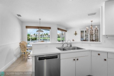 With serene views of the water and golf course, a 2021 roof, and on The Boca Country Club in Florida - for sale on GolfHomes.com, golf home, golf lot