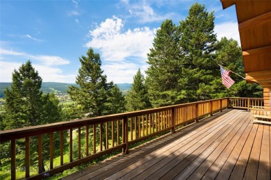 This charming log home, nestled in the trees and perched above on Big Sky of Montana Golf Course in Montana - for sale on GolfHomes.com, golf home, golf lot