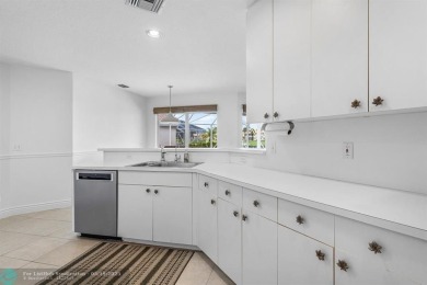 With serene views of the water and golf course, a 2021 roof, and on The Boca Country Club in Florida - for sale on GolfHomes.com, golf home, golf lot