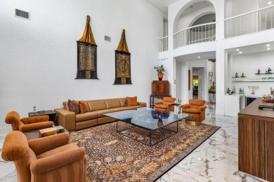 Soaring two-story ceiling heights greet you upon entering this on Polo Club of Boca Raton in Florida - for sale on GolfHomes.com, golf home, golf lot