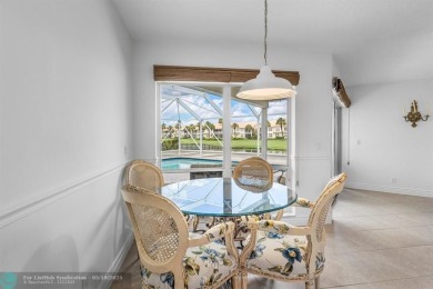 With serene views of the water and golf course, a 2021 roof, and on The Boca Country Club in Florida - for sale on GolfHomes.com, golf home, golf lot
