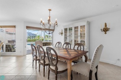 With serene views of the water and golf course, a 2021 roof, and on The Boca Country Club in Florida - for sale on GolfHomes.com, golf home, golf lot