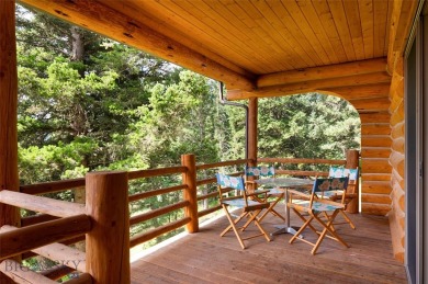 This charming log home, nestled in the trees and perched above on Big Sky of Montana Golf Course in Montana - for sale on GolfHomes.com, golf home, golf lot