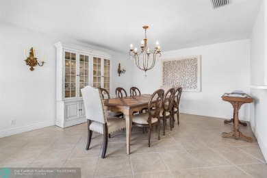 With serene views of the water and golf course, a 2021 roof, and on The Boca Country Club in Florida - for sale on GolfHomes.com, golf home, golf lot