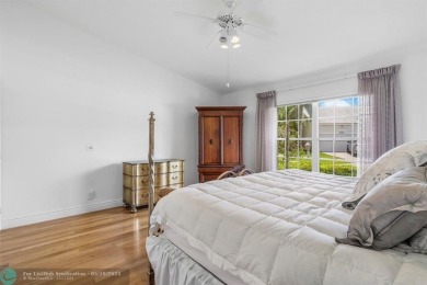 With serene views of the water and golf course, a 2021 roof, and on The Boca Country Club in Florida - for sale on GolfHomes.com, golf home, golf lot