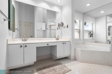 With serene views of the water and golf course, a 2021 roof, and on The Boca Country Club in Florida - for sale on GolfHomes.com, golf home, golf lot