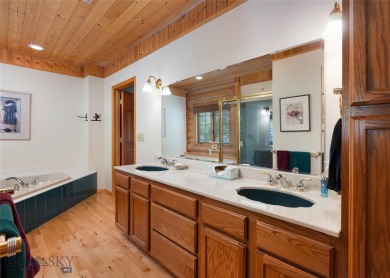 This charming log home, nestled in the trees and perched above on Big Sky of Montana Golf Course in Montana - for sale on GolfHomes.com, golf home, golf lot