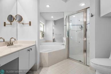 With serene views of the water and golf course, a 2021 roof, and on The Boca Country Club in Florida - for sale on GolfHomes.com, golf home, golf lot
