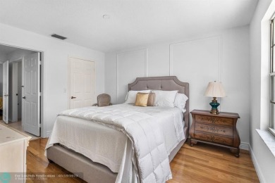 With serene views of the water and golf course, a 2021 roof, and on The Boca Country Club in Florida - for sale on GolfHomes.com, golf home, golf lot