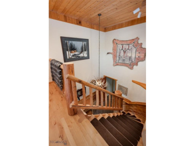 This charming log home, nestled in the trees and perched above on Big Sky of Montana Golf Course in Montana - for sale on GolfHomes.com, golf home, golf lot