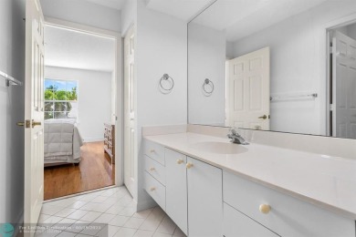 With serene views of the water and golf course, a 2021 roof, and on The Boca Country Club in Florida - for sale on GolfHomes.com, golf home, golf lot