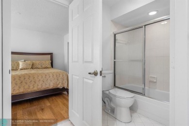 With serene views of the water and golf course, a 2021 roof, and on The Boca Country Club in Florida - for sale on GolfHomes.com, golf home, golf lot