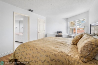 With serene views of the water and golf course, a 2021 roof, and on The Boca Country Club in Florida - for sale on GolfHomes.com, golf home, golf lot