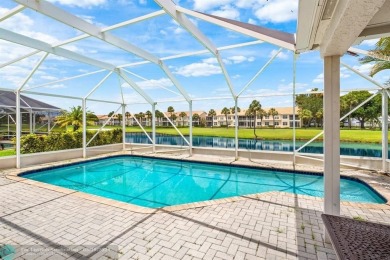 With serene views of the water and golf course, a 2021 roof, and on The Boca Country Club in Florida - for sale on GolfHomes.com, golf home, golf lot
