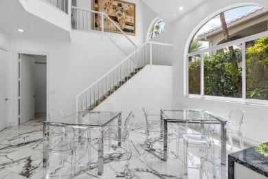 Soaring two-story ceiling heights greet you upon entering this on Polo Club of Boca Raton in Florida - for sale on GolfHomes.com, golf home, golf lot