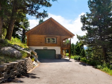 This charming log home, nestled in the trees and perched above on Big Sky of Montana Golf Course in Montana - for sale on GolfHomes.com, golf home, golf lot