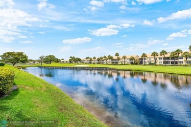 With serene views of the water and golf course, a 2021 roof, and on The Boca Country Club in Florida - for sale on GolfHomes.com, golf home, golf lot