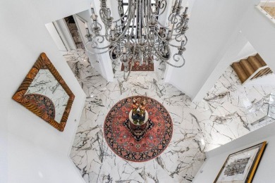 Soaring two-story ceiling heights greet you upon entering this on Polo Club of Boca Raton in Florida - for sale on GolfHomes.com, golf home, golf lot