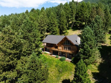 This charming log home, nestled in the trees and perched above on Big Sky of Montana Golf Course in Montana - for sale on GolfHomes.com, golf home, golf lot