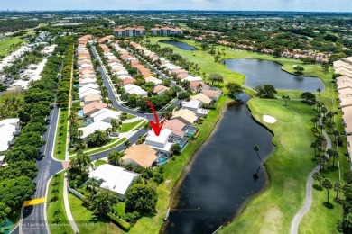 With serene views of the water and golf course, a 2021 roof, and on The Boca Country Club in Florida - for sale on GolfHomes.com, golf home, golf lot