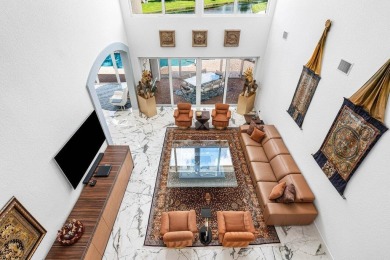 Soaring two-story ceiling heights greet you upon entering this on Polo Club of Boca Raton in Florida - for sale on GolfHomes.com, golf home, golf lot