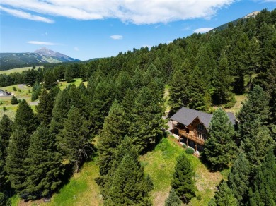 This charming log home, nestled in the trees and perched above on Big Sky of Montana Golf Course in Montana - for sale on GolfHomes.com, golf home, golf lot