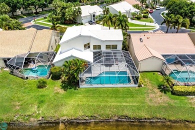 With serene views of the water and golf course, a 2021 roof, and on The Boca Country Club in Florida - for sale on GolfHomes.com, golf home, golf lot