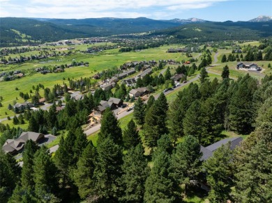 This charming log home, nestled in the trees and perched above on Big Sky of Montana Golf Course in Montana - for sale on GolfHomes.com, golf home, golf lot