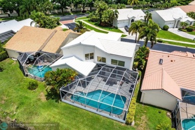 With serene views of the water and golf course, a 2021 roof, and on The Boca Country Club in Florida - for sale on GolfHomes.com, golf home, golf lot