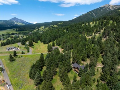 This charming log home, nestled in the trees and perched above on Big Sky of Montana Golf Course in Montana - for sale on GolfHomes.com, golf home, golf lot