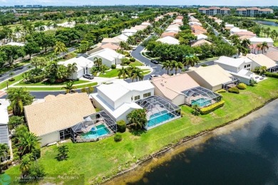 With serene views of the water and golf course, a 2021 roof, and on The Boca Country Club in Florida - for sale on GolfHomes.com, golf home, golf lot
