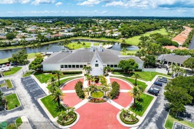 With serene views of the water and golf course, a 2021 roof, and on The Boca Country Club in Florida - for sale on GolfHomes.com, golf home, golf lot