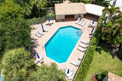 With serene views of the water and golf course, a 2021 roof, and on The Boca Country Club in Florida - for sale on GolfHomes.com, golf home, golf lot
