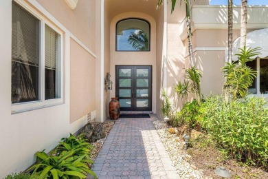 Soaring two-story ceiling heights greet you upon entering this on Polo Club of Boca Raton in Florida - for sale on GolfHomes.com, golf home, golf lot