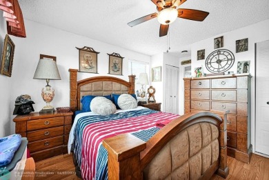 Welcome to this unique 2-bedroom, 2-bathroom corner unit on the on Sunrise Lakes Phase IV Golf Course in Florida - for sale on GolfHomes.com, golf home, golf lot