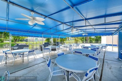 Welcome to this unique 2-bedroom, 2-bathroom corner unit on the on Sunrise Lakes Phase IV Golf Course in Florida - for sale on GolfHomes.com, golf home, golf lot