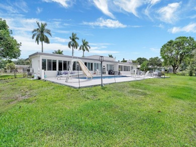 Plantation Golf Estates home sits directly on the golf course w/ on Plantation Preserve Golf Course in Florida - for sale on GolfHomes.com, golf home, golf lot