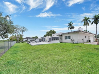 Plantation Golf Estates home sits directly on the golf course w/ on Plantation Preserve Golf Course in Florida - for sale on GolfHomes.com, golf home, golf lot