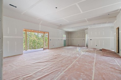 Tucked inside a gated golf community, this newly constructed on Ledgestone Country Club and Golf Course in Missouri - for sale on GolfHomes.com, golf home, golf lot